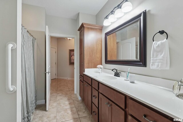 1237 Kimberly Rd, Bettendorf, IA 52722 - bathroom featuring vanity and tile patterned floors