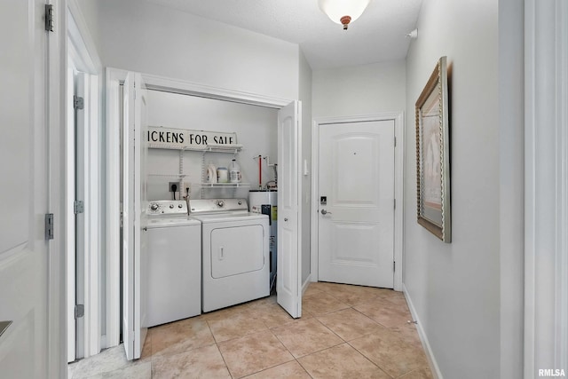 1237 Kimberly Rd, Bettendorf, IA 52722 - laundry area with washing machine and dryer and light tile patterned flooring