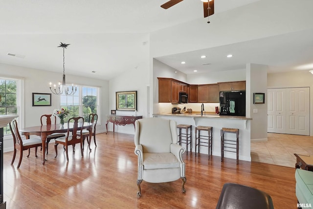 1237 Kimberly Rd, Bettendorf, IA 52722 - living room with plenty of natural light, lofted ceiling, a chandelier, light wood-type flooring, and recessed lighting