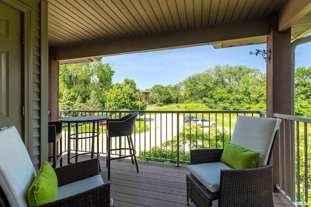 1237 Kimberly Rd, Bettendorf, IA 52722 - balcony featuring view of scattered trees