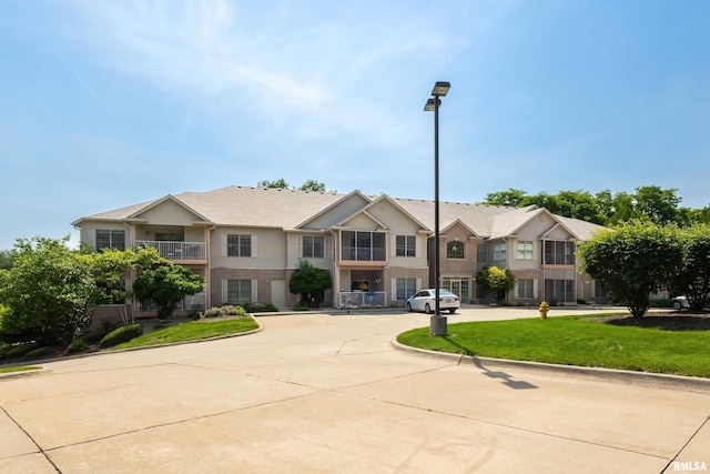 1237 Kimberly Rd, Bettendorf, IA 52722 - multi unit property with brick siding and a front lawn