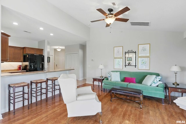 1237 Kimberly Rd, Bettendorf, IA 52722 - living area featuring light wood-style floors, lofted ceiling, a ceiling fan, and recessed lighting