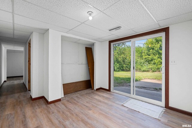 3796 160th St, Bryant, IA 52727 - spare room with a paneled ceiling and wood finished floors