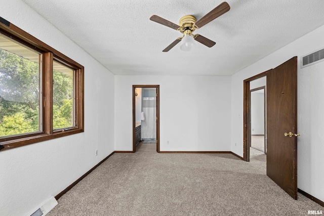 3796 160th St, Bryant, IA 52727 - carpeted spare room featuring ceiling fan and a textured ceiling