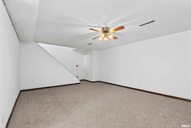 3796 160th St, Bryant, IA 52727 - carpeted empty room featuring ceiling fan and a textured ceiling