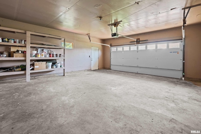 3796 160th St, Bryant, IA 52727 - garage featuring a garage door opener