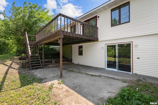3796 160th St, Bryant, IA 52727 - back of property featuring a patio, a deck, and stairway