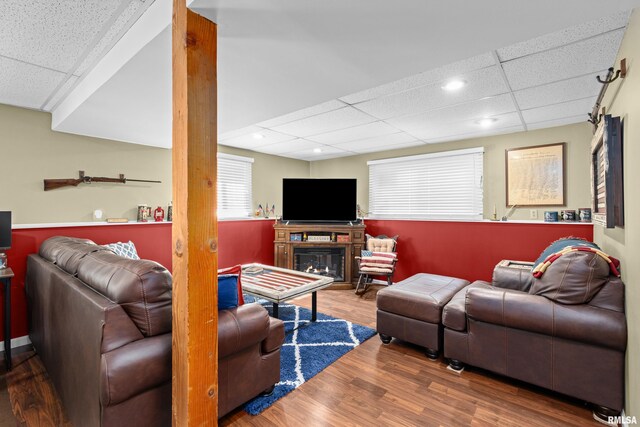 404 34th Ave, East Moline, IL 61244 - living area featuring a drop ceiling, wood finished floors, a glass covered fireplace, and recessed lighting