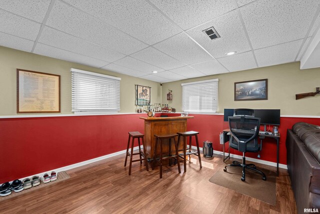 404 34th Ave, East Moline, IL 61244 - office featuring a drop ceiling, wood finished floors, and a dry bar