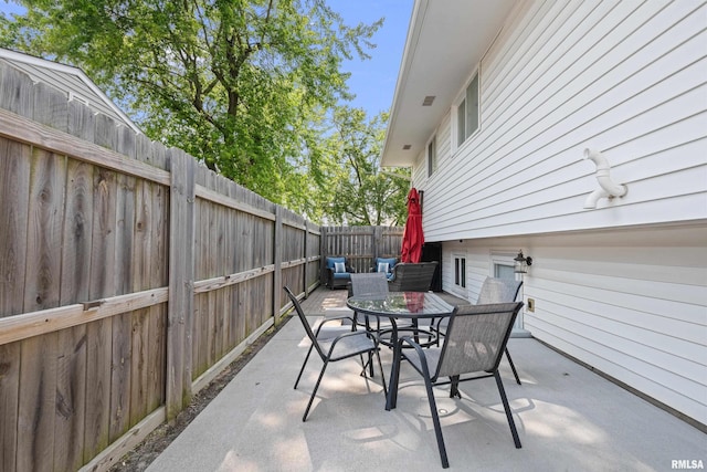 404 34th Ave, East Moline, IL 61244 - fenced backyard featuring outdoor dining space and a patio area