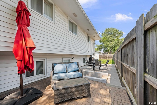 404 34th Ave, East Moline, IL 61244 - fenced backyard with a patio area, an outdoor hangout area, and outdoor dining area