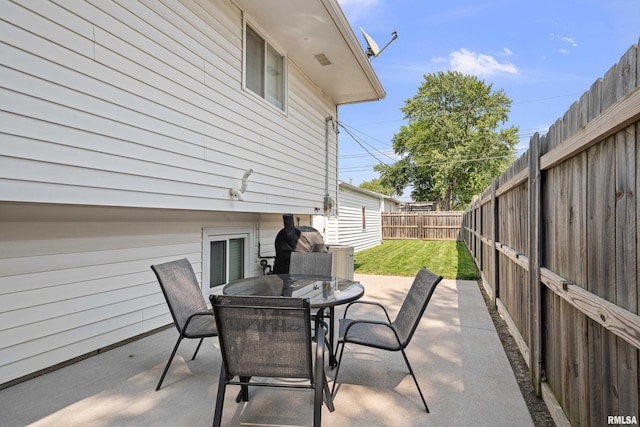 404 34th Ave, East Moline, IL 61244 - fenced backyard featuring outdoor dining area and a patio