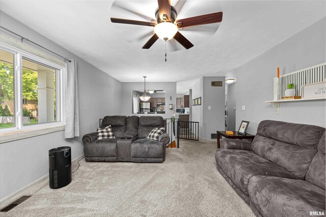 404 34th Ave, East Moline, IL 61244 - living area featuring carpet floors and ceiling fan