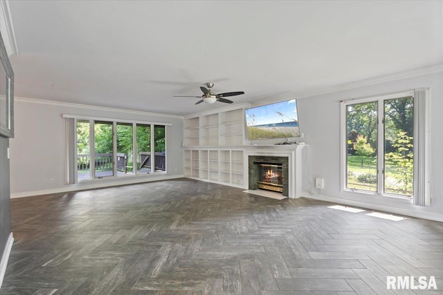 4319 7th Ave, Moline, IL 61265 - unfurnished living room featuring a fireplace with flush hearth, ornamental molding, ceiling fan, and built in features