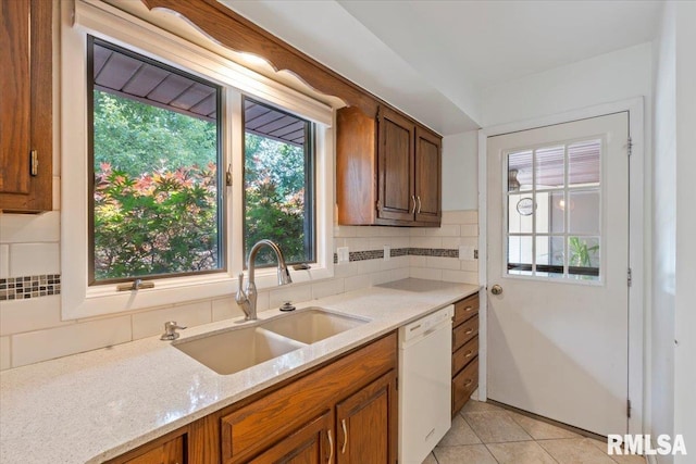 4319 7th Ave, Moline, IL 61265 - kitchen with dishwasher, decorative backsplash, healthy amount of natural light, and brown cabinets