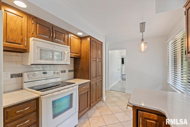 4319 7th Ave, Moline, IL 61265 - kitchen featuring white appliances, decorative backsplash, light countertops, and recessed lighting