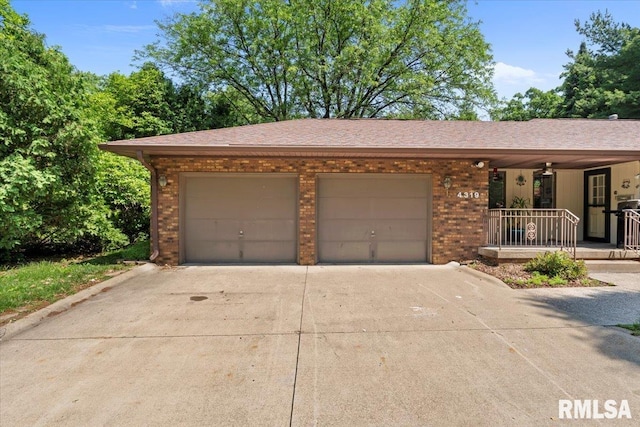 4319 7th Ave, Moline, IL 61265 - ranch-style home with concrete driveway, a garage, brick siding, and a porch