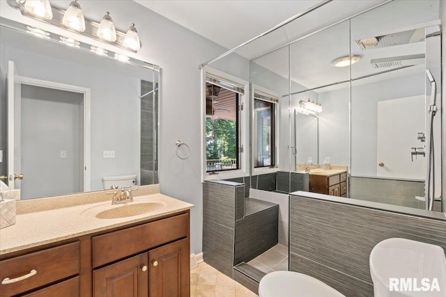 4319 7th Ave, Moline, IL 61265 - bathroom with two vanities, tile patterned floors, and a shower