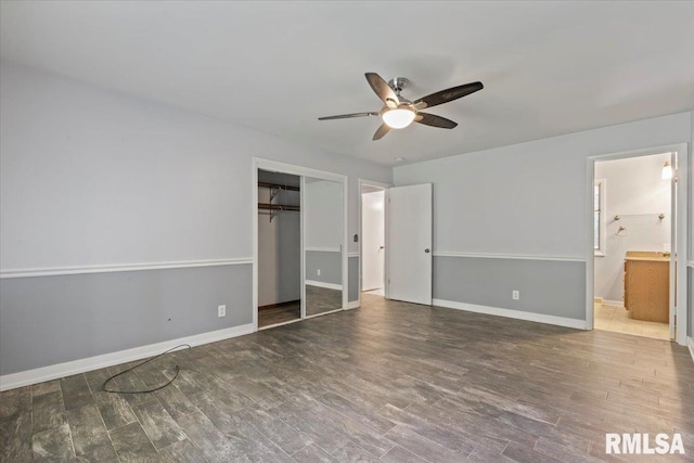 4319 7th Ave, Moline, IL 61265 - unfurnished bedroom with wood finished floors, a closet, connected bathroom, and ceiling fan