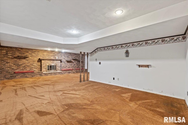 4319 7th Ave, Moline, IL 61265 - unfurnished living room featuring brick wall, carpet floors, a brick fireplace, and recessed lighting