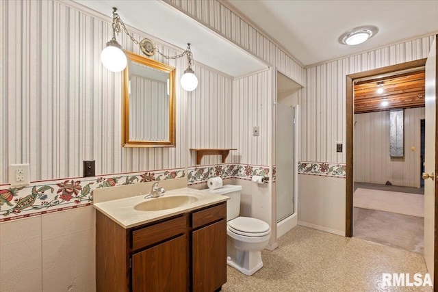 4319 7th Ave, Moline, IL 61265 - bathroom with wallpapered walls, vanity, a stall shower, and a wainscoted wall