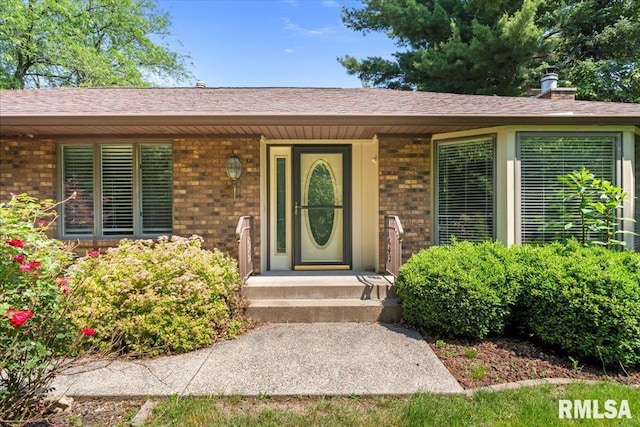4319 7th Ave, Moline, IL 61265 - property entrance featuring brick siding, a shingled roof, and a porch