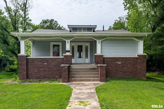 614 S Calumet St, Marion, IL 62959 - bungalow-style house featuring brick siding, a front yard, and a porch