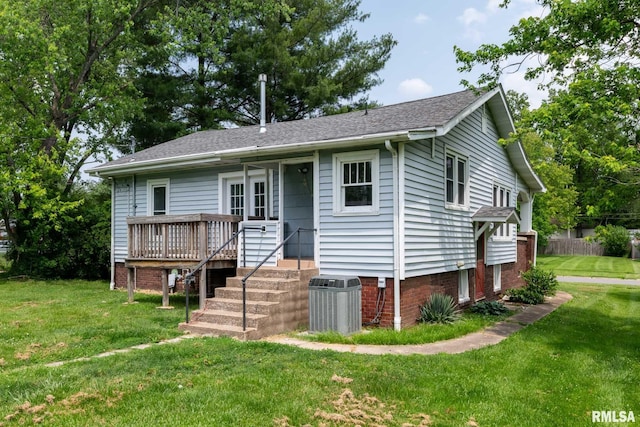 614 S Calumet St, Marion, IL 62959 - view of front facade featuring a front lawn, a wooden deck, and a shingled roof