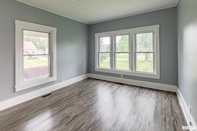 614 S Calumet St, Marion, IL 62959 - unfurnished room with crown molding and dark wood-style flooring