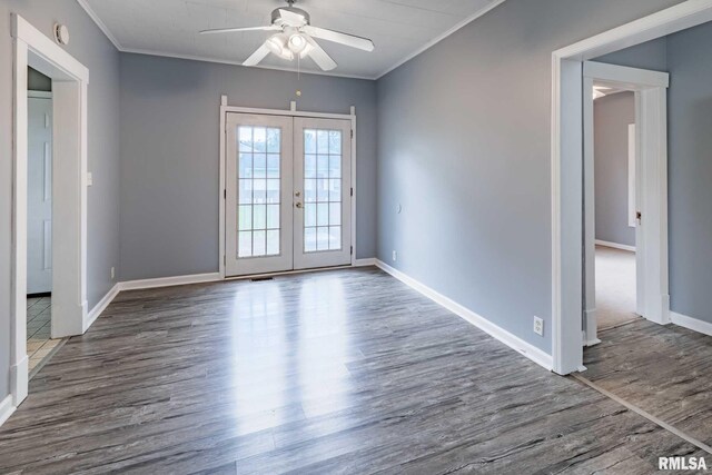 614 S Calumet St, Marion, IL 62959 - spare room featuring ceiling fan, french doors, ornamental molding, wood finished floors, and a smoke detector