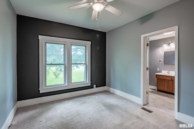 614 S Calumet St, Marion, IL 62959 - spare room with light carpet and a ceiling fan