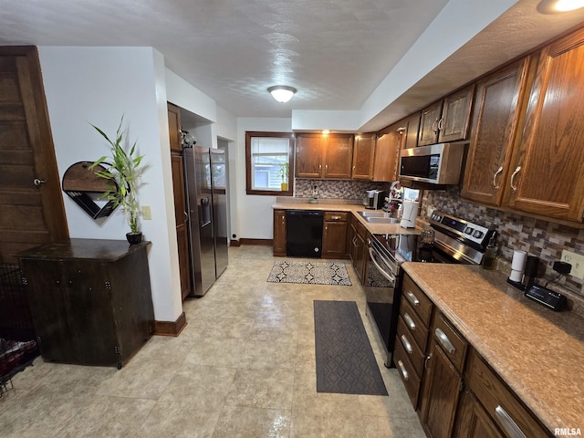 610 NW 6th St, Aledo, IL 61231 - kitchen featuring appliances with stainless steel finishes, tasteful backsplash, and light countertops