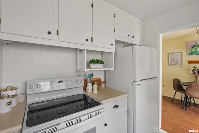 3626 15th Avenue Ct, Moline, IL 61265 - kitchen featuring white appliances, white cabinets, light countertops, open shelves, and light wood-style floors
