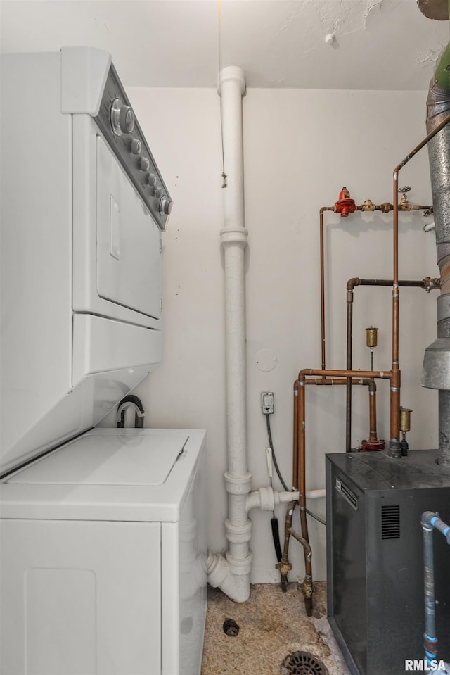 3626 15th Avenue Ct, Moline, IL 61265 - laundry room with stacked washer and clothes dryer and a heating unit