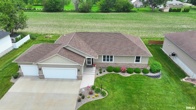 101 Prairie View Ct, Clinton, IA 52732 - ranch-style home featuring an attached garage, driveway, a shingled roof, brick siding, and stone siding