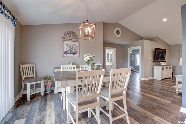 101 Prairie View Ct, Clinton, IA 52732 - dining room with dark wood-style flooring, a chandelier, and vaulted ceiling