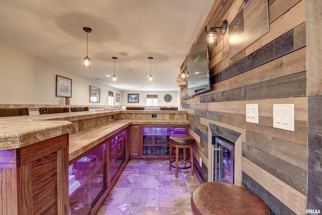 101 Prairie View Ct, Clinton, IA 52732 - community bar area with beverage cooler, stone finish floors, pendant lighting, and a fireplace