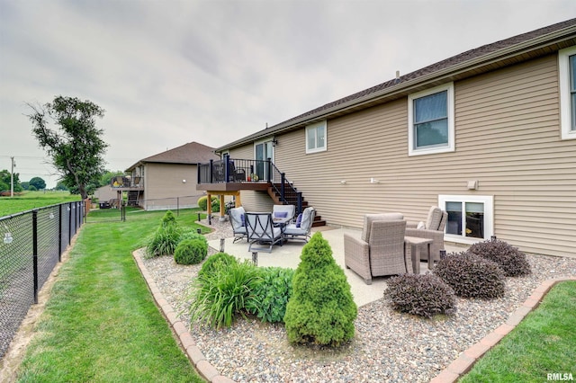 101 Prairie View Ct, Clinton, IA 52732 - rear view of property featuring a fenced backyard, stairway, a wooden deck, and a patio area