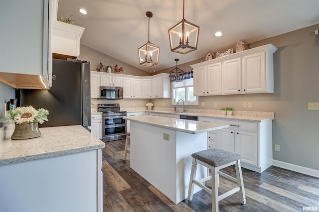 101 Prairie View Ct, Clinton, IA 52732 - kitchen with appliances with stainless steel finishes, a center island, white cabinetry, a chandelier, and dark wood-style floors