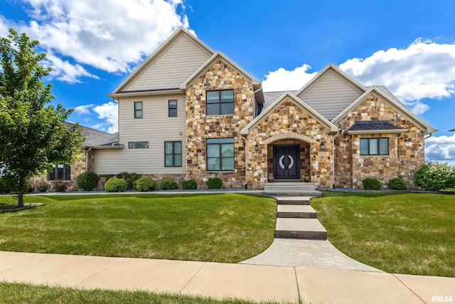 5541 Pigeon Creek Rd, Bettendorf, IA 52722 - craftsman-style home featuring stone siding and a front lawn