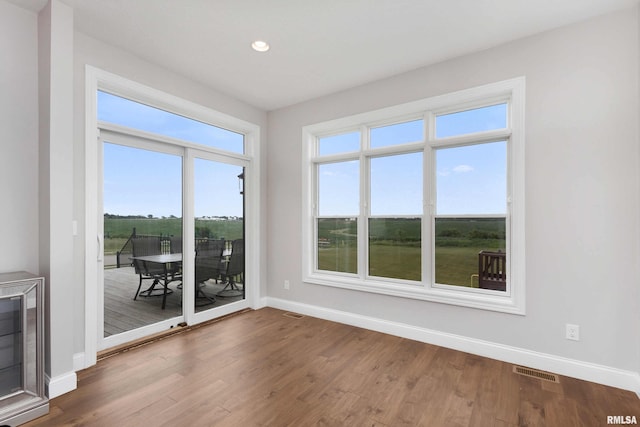 5541 Pigeon Creek Rd, Bettendorf, IA 52722 - empty room with recessed lighting and wood finished floors