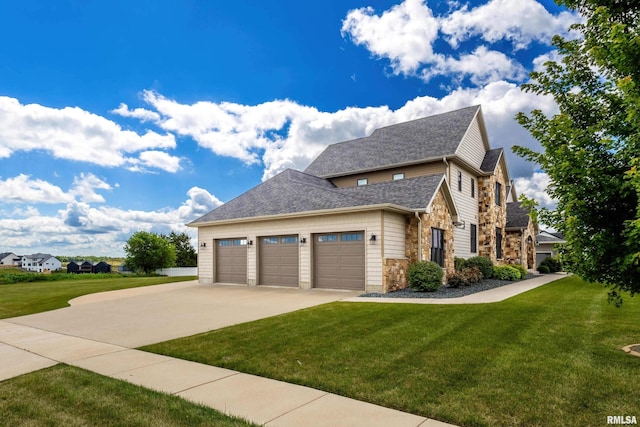 5541 Pigeon Creek Rd, Bettendorf, IA 52722 - view of property exterior featuring stone siding, a lawn, driveway, and an attached garage