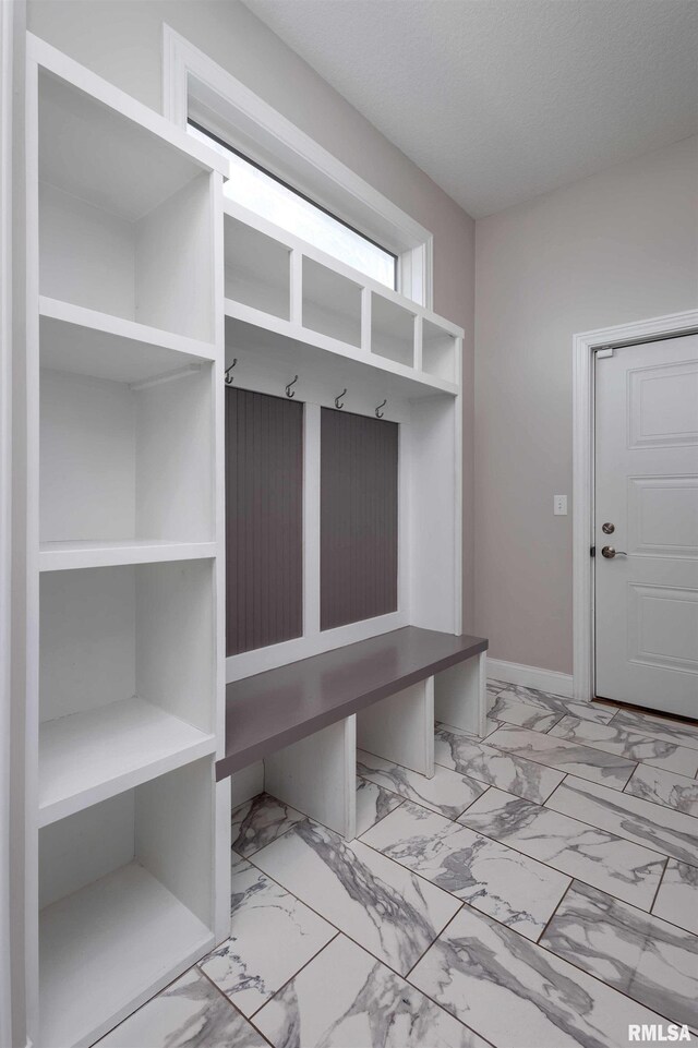 5541 Pigeon Creek Rd, Bettendorf, IA 52722 - mudroom featuring marble finish flooring