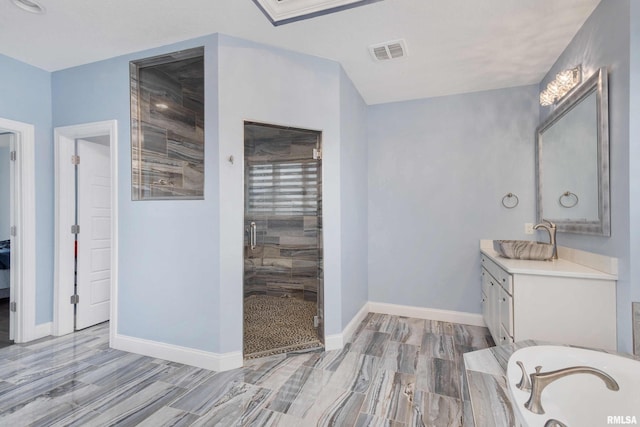5541 Pigeon Creek Rd, Bettendorf, IA 52722 - bathroom with a shower stall, vanity, a bath, and wood finish floors