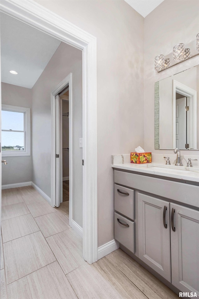 5541 Pigeon Creek Rd, Bettendorf, IA 52722 - bathroom featuring vanity and wood finished floors