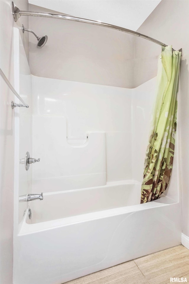 5541 Pigeon Creek Rd, Bettendorf, IA 52722 - bathroom featuring shower / bathtub combination with curtain