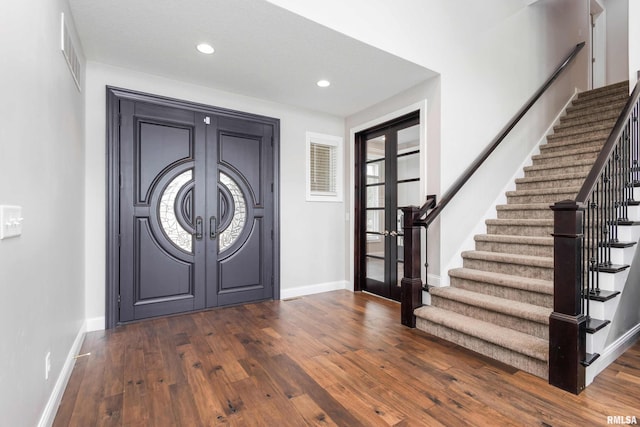 5541 Pigeon Creek Rd, Bettendorf, IA 52722 - foyer featuring french doors, stairway, dark wood-style floors, and recessed lighting