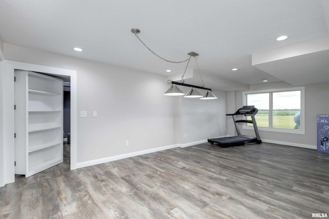 5541 Pigeon Creek Rd, Bettendorf, IA 52722 - workout area with wood finished floors and recessed lighting