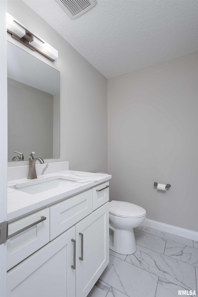 5541 Pigeon Creek Rd, Bettendorf, IA 52722 - half bath with marble look tile flooring, vanity, and a textured ceiling