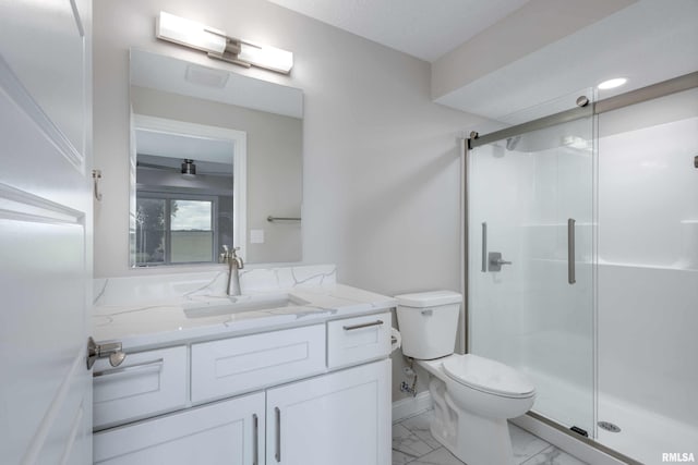 5541 Pigeon Creek Rd, Bettendorf, IA 52722 - bathroom featuring vanity, a stall shower, and marble finish flooring